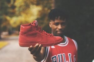 Man Holding Fake Nike Shoe